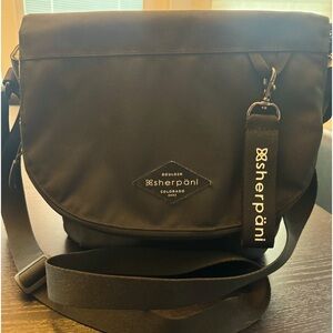 Sherpani black, nylon, flap cross body bag - like new condition.
